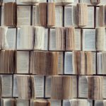 Open books, Abstract blur and defocused bookshelf in library interior for background